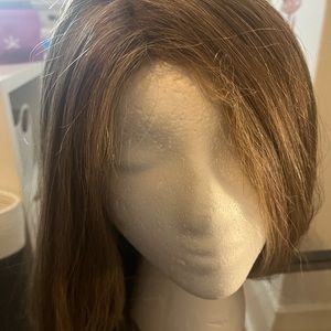 Real hair wig. Very cute. Can be styled curly or straight.
